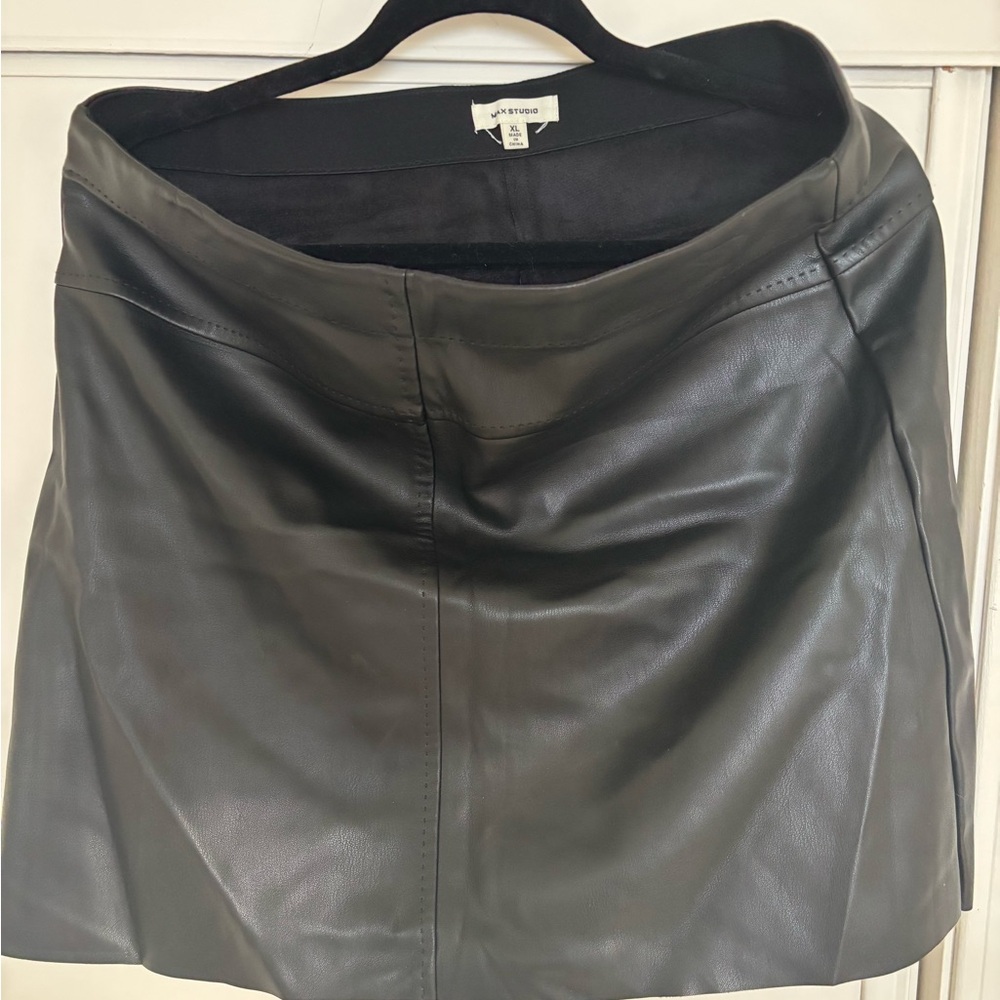 Short vegan leather skirt.